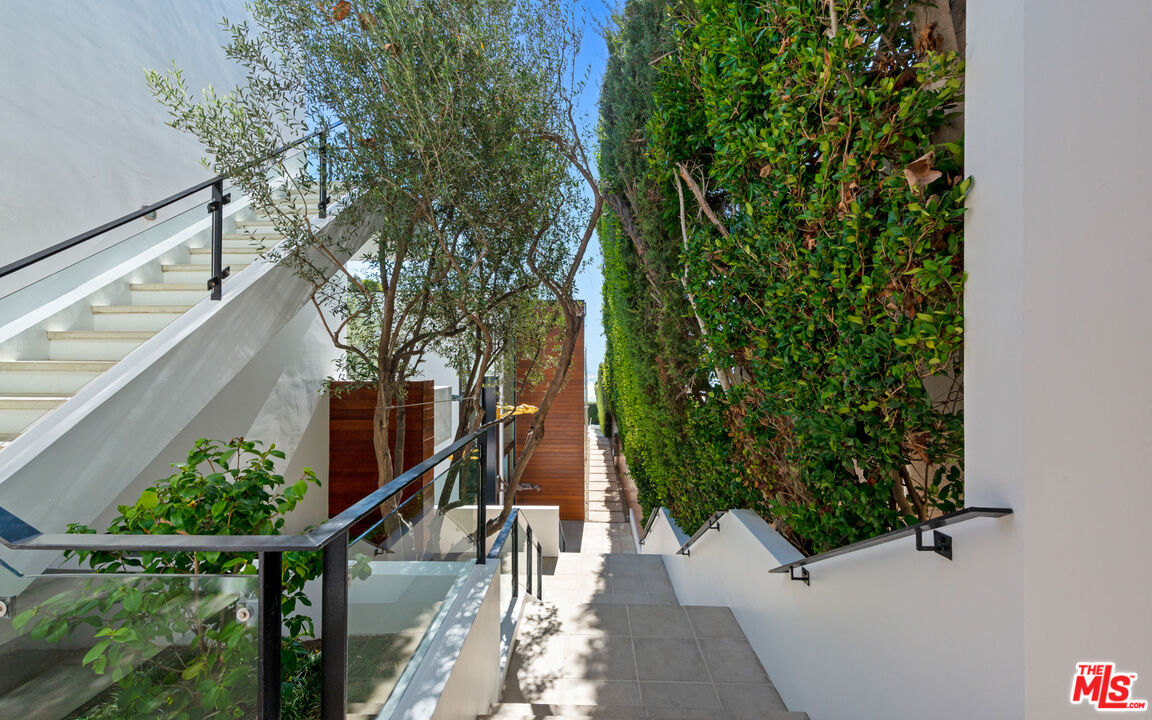 31240 Broad Beach Road Malibu, CA 90265 - Photo 3 of 54 a view of a house with large trees