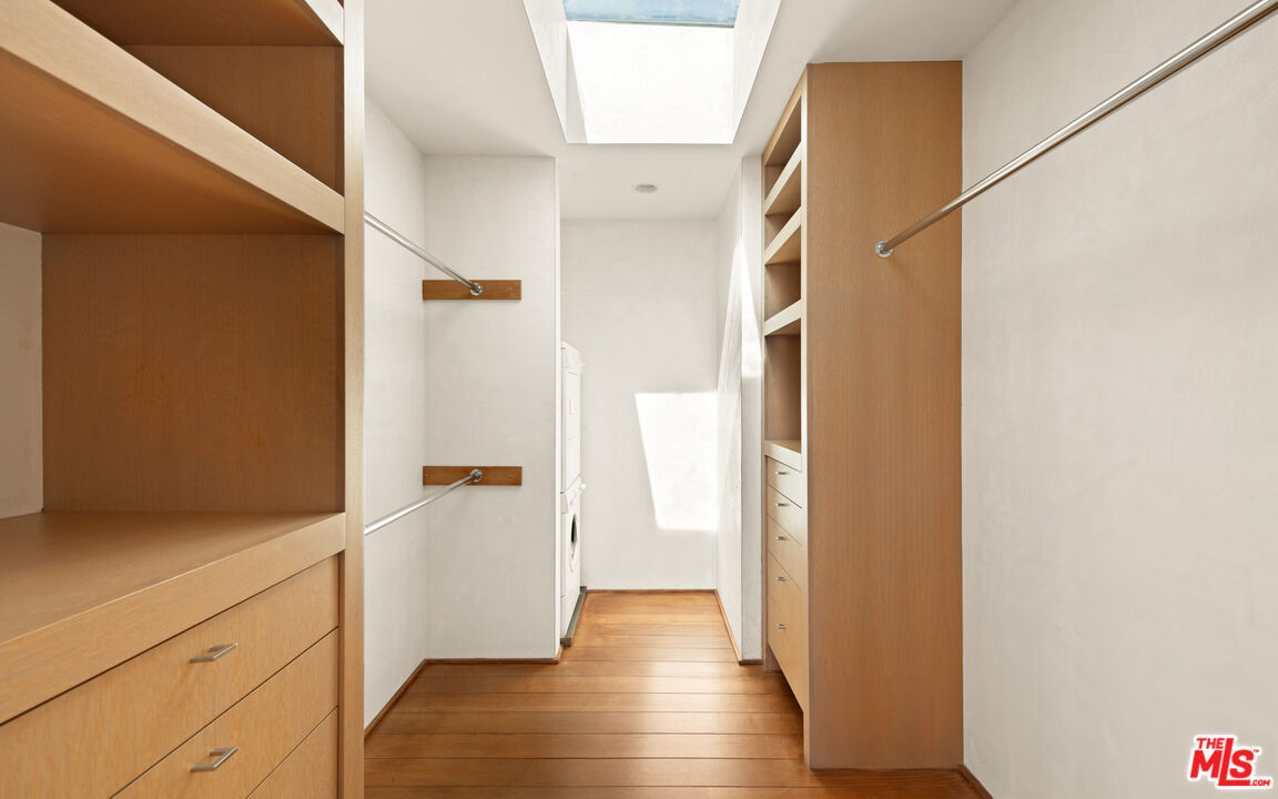 31240 Broad Beach Road Malibu, CA 90265 - Photo 32 of 54 a view of walk in closet with wooden floor