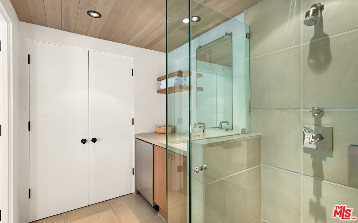31240 Broad Beach Road Malibu, CA 90265 - Photo 39 of 54 a bathroom with a shower and a mirror