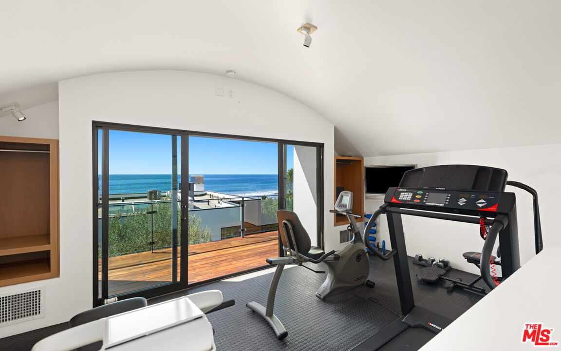31240 Broad Beach Road Malibu, CA 90265 - Photo 41 of 54 a view of a room with gym equipment