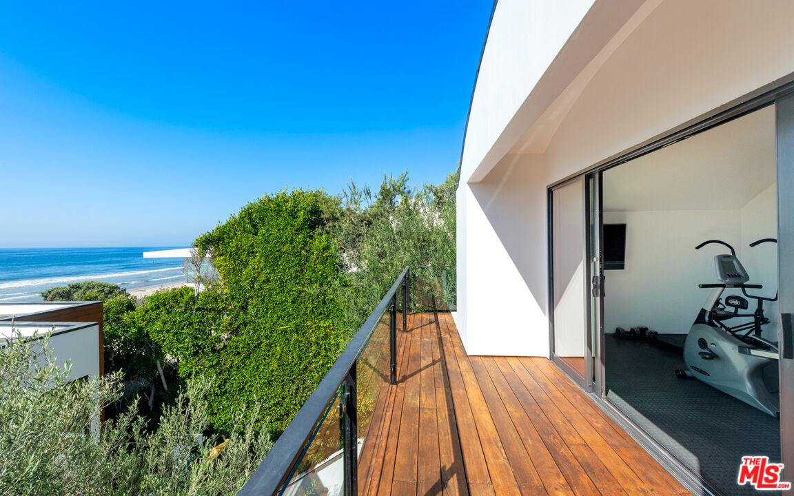 31240 Broad Beach Road Malibu, CA 90265 - Photo 42 of 54 a view of balcony with wooden floor and fence