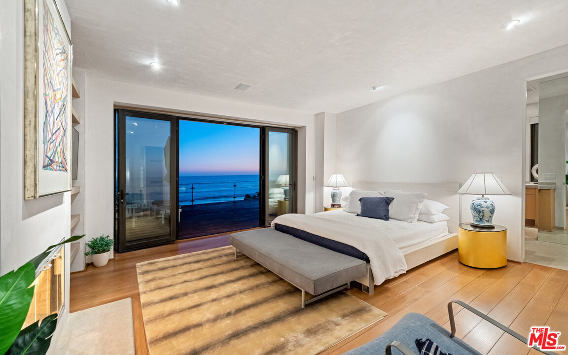 31240 Broad Beach Road Malibu, CA 90265 - Photo 52 of 54 a bedroom with a bed and a large window