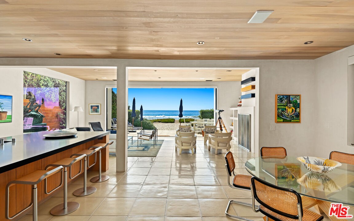 31240 Broad Beach Road Malibu, CA 90265 - Photo 7 of 54 a living room with furniture a rug and white kitchen view