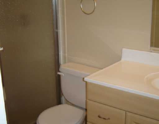 5551 Northwest 5th Avenue Boca Raton, FL 33487 - Photo 3 of 5 a bathroom with a toilet and a sink