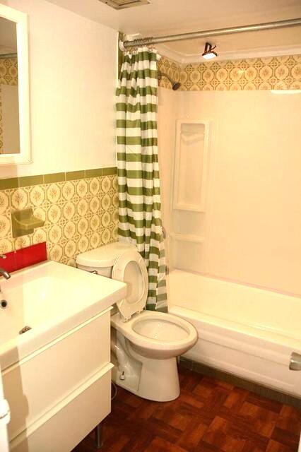 453 Southwest 2nd Street, Unit 208B Miami, FL 33130 - Photo 12 of 23 a bathroom with a toilet and a bathtub