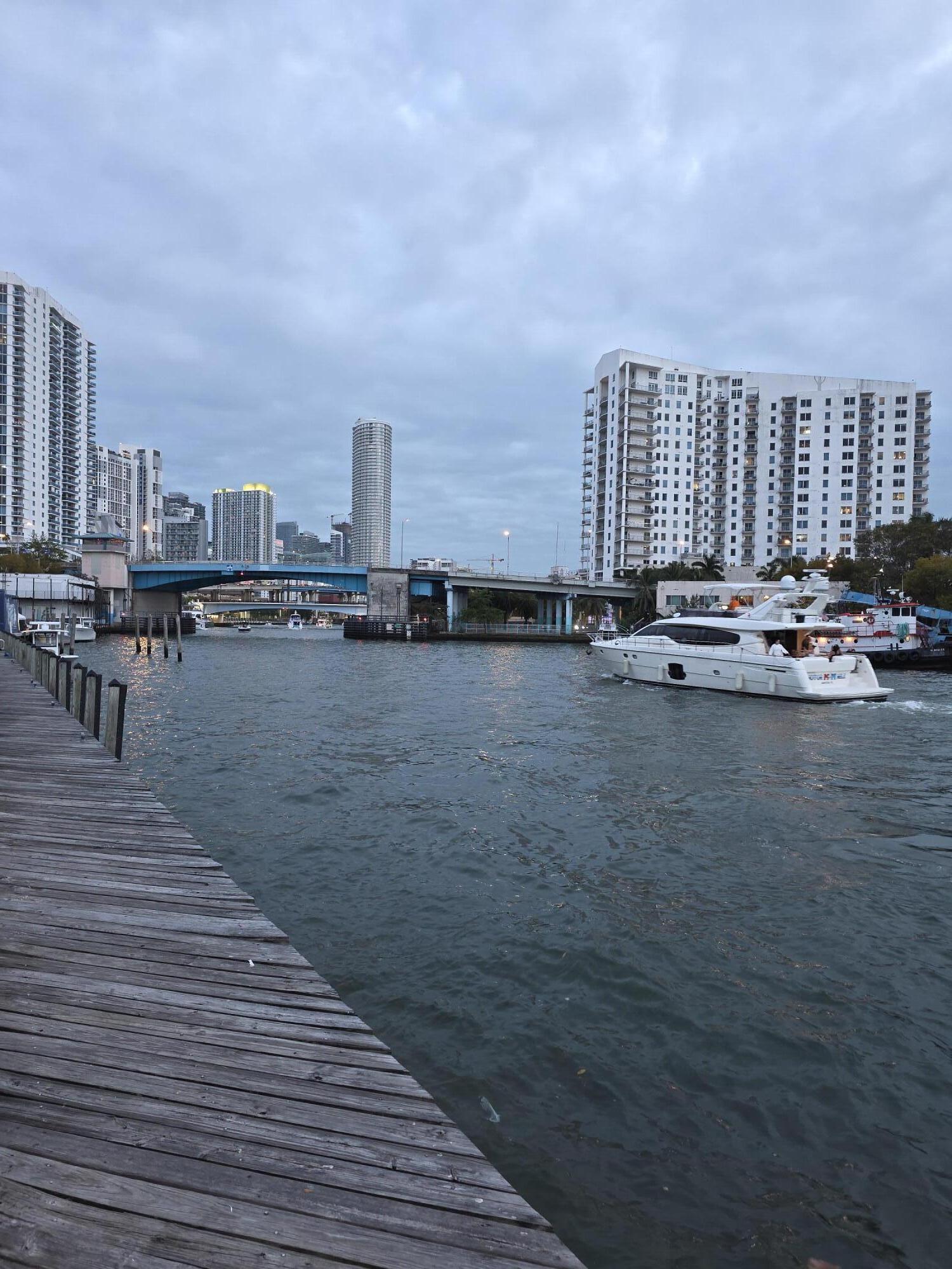 453 Southwest 2nd Street, Unit 208B Miami, FL 33130 - Photo 19 of 23 a view of a terrace with wooden floor and city view