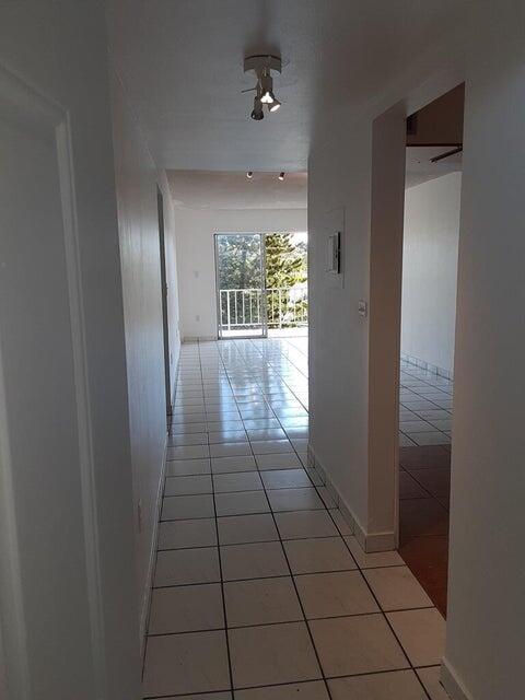 453 Southwest 2nd Street, Unit 208B Miami, FL 33130 - Photo 3 of 23 a view of hallway with windows