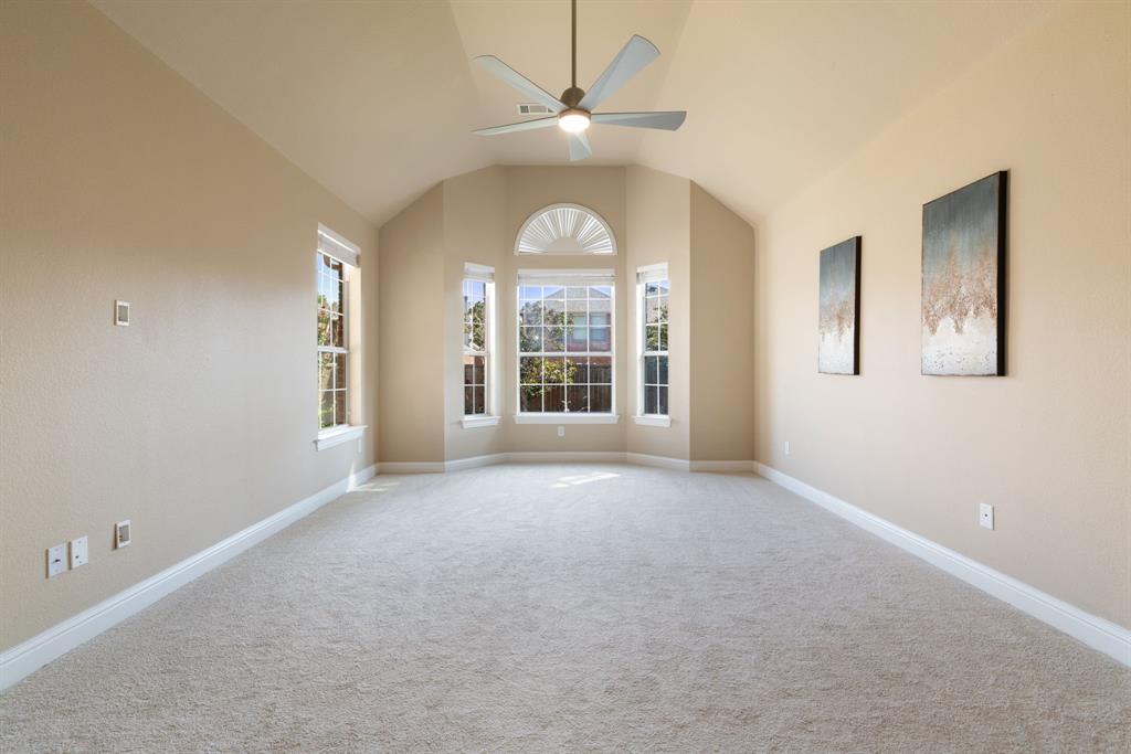 2475 Brazos Drive Frisco, TX 75033 - Photo 15 of 34 an empty room with windows and chandelier fan