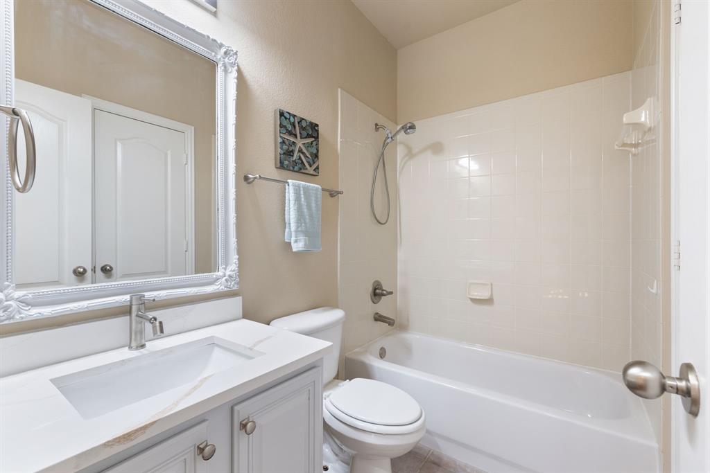 2475 Brazos Drive Frisco, TX 75033 - Photo 22 of 34 a bathroom with a sink a toilet and shower