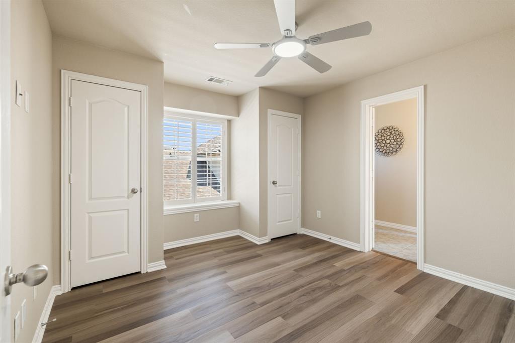 2475 Brazos Drive Frisco, TX 75033 - Photo 25 of 34 an empty room with wooden floor closet and windows