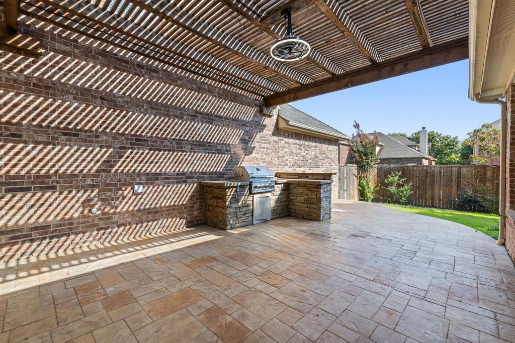 2475 Brazos Drive Frisco, TX 75033 - Photo 31 of 34 a view of an empty room with a fireplace