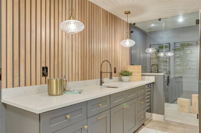 a bathroom with a granite countertop sink a toilet and bathtub