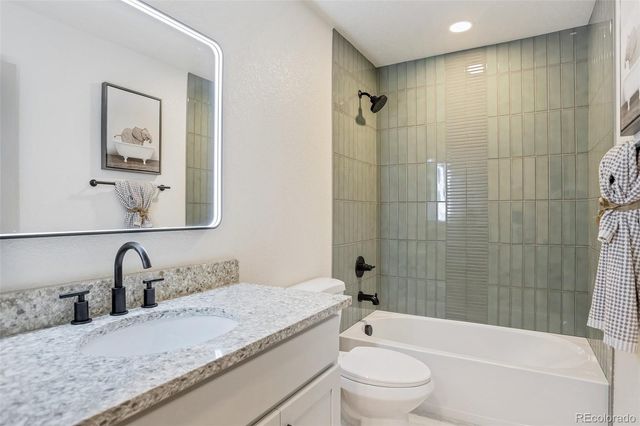 a spacious bedroom with a bed and a window