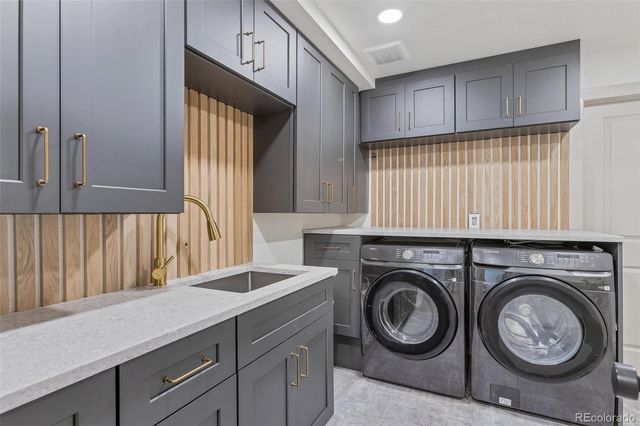 a bathroom with a toilet mirror and sink