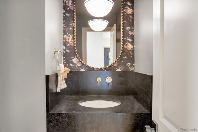 a view of empty room with wooden floor and windows