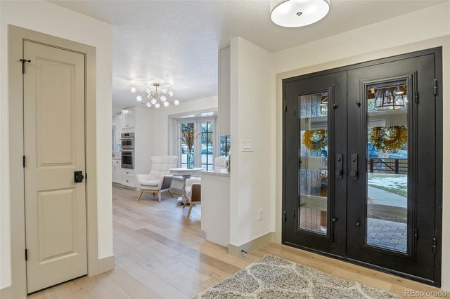 a view of a hallway with dining area and living room view