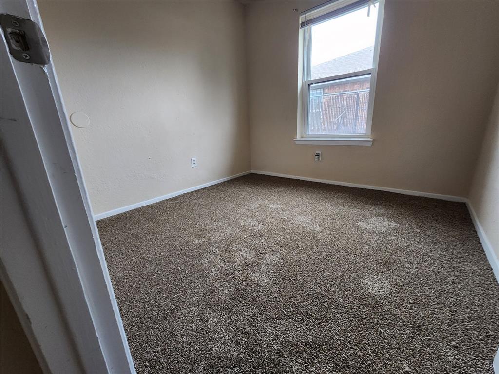 4304 South Cravens Road Fort Worth, TX 76119 - Photo 6 of 21 Unfurnished room featuring carpet flooring