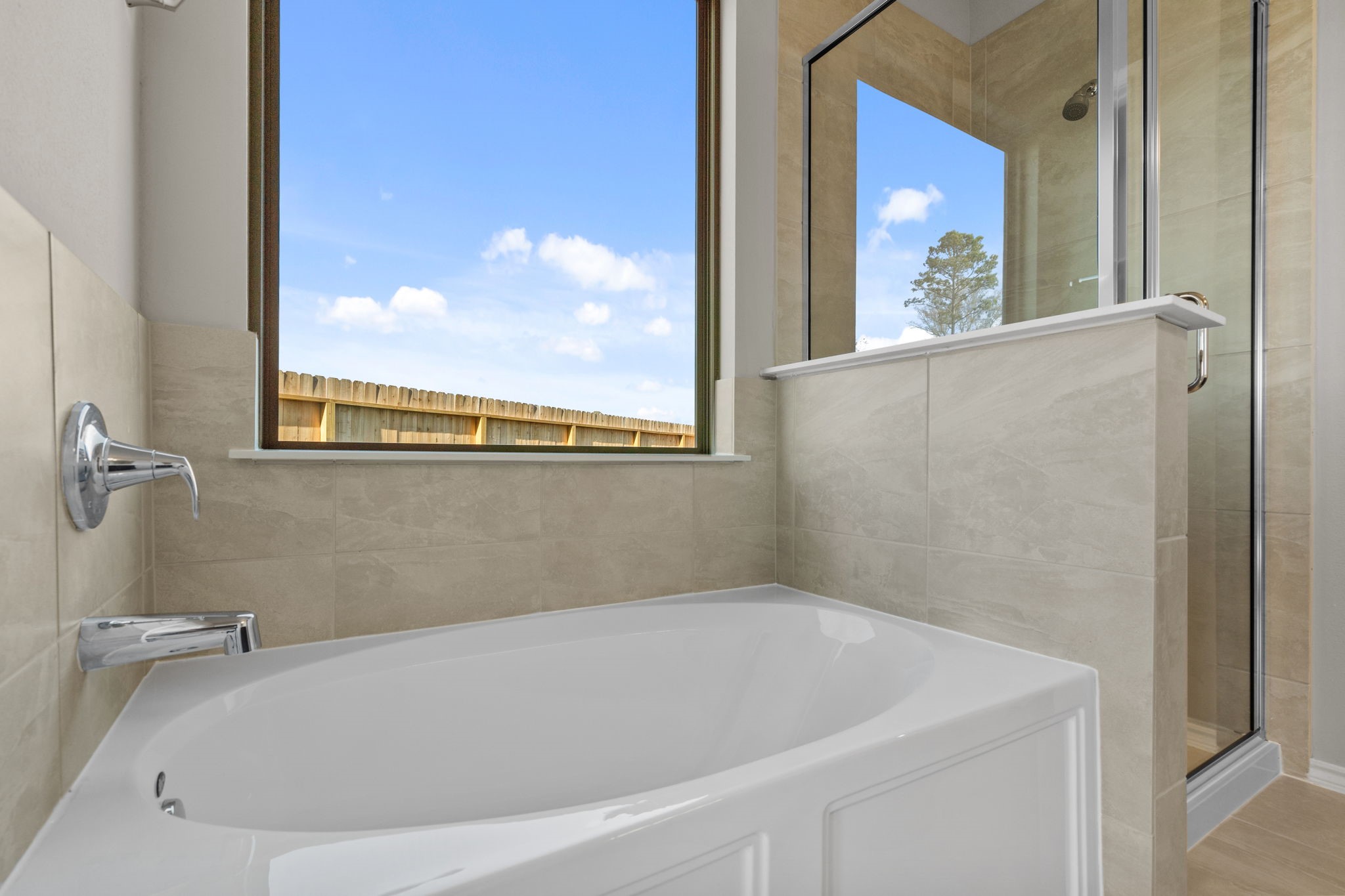 32027 Retama Rnch Drive Spring, TX 77386 - Photo 17 of 33 a white bath tub sitting next to a window