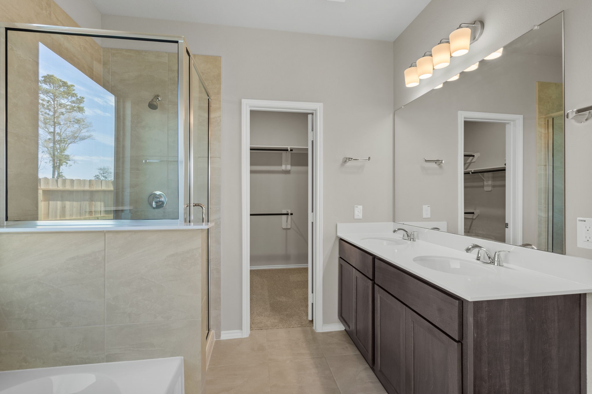 32027 Retama Rnch Drive Spring, TX 77386 - Photo 18 of 33 a bathroom with a double vanity sink mirror and shower