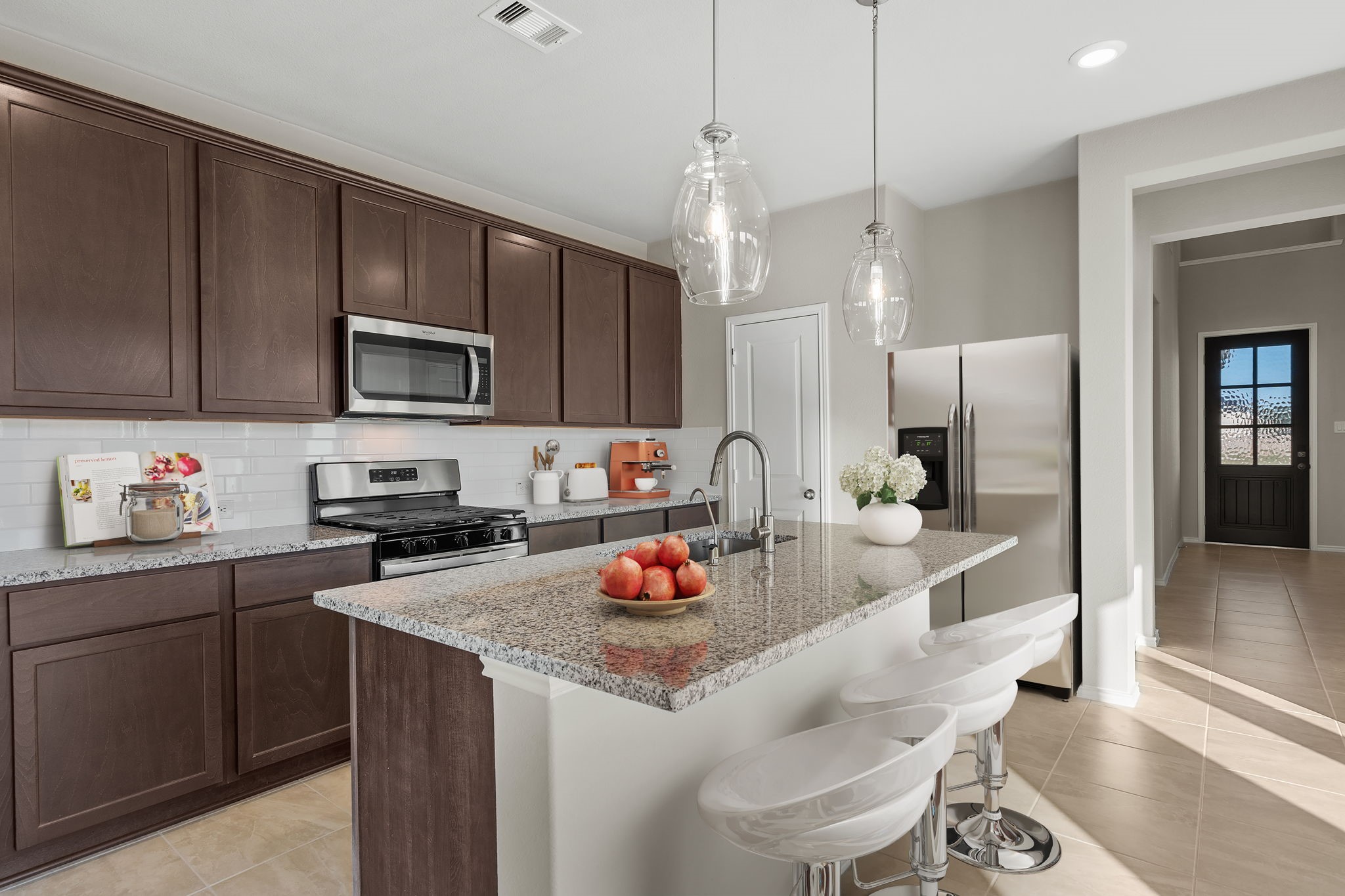 32027 Retama Rnch Drive Spring, TX 77386 - Photo 2 of 33 a kitchen with granite countertop a sink stove and cabinets