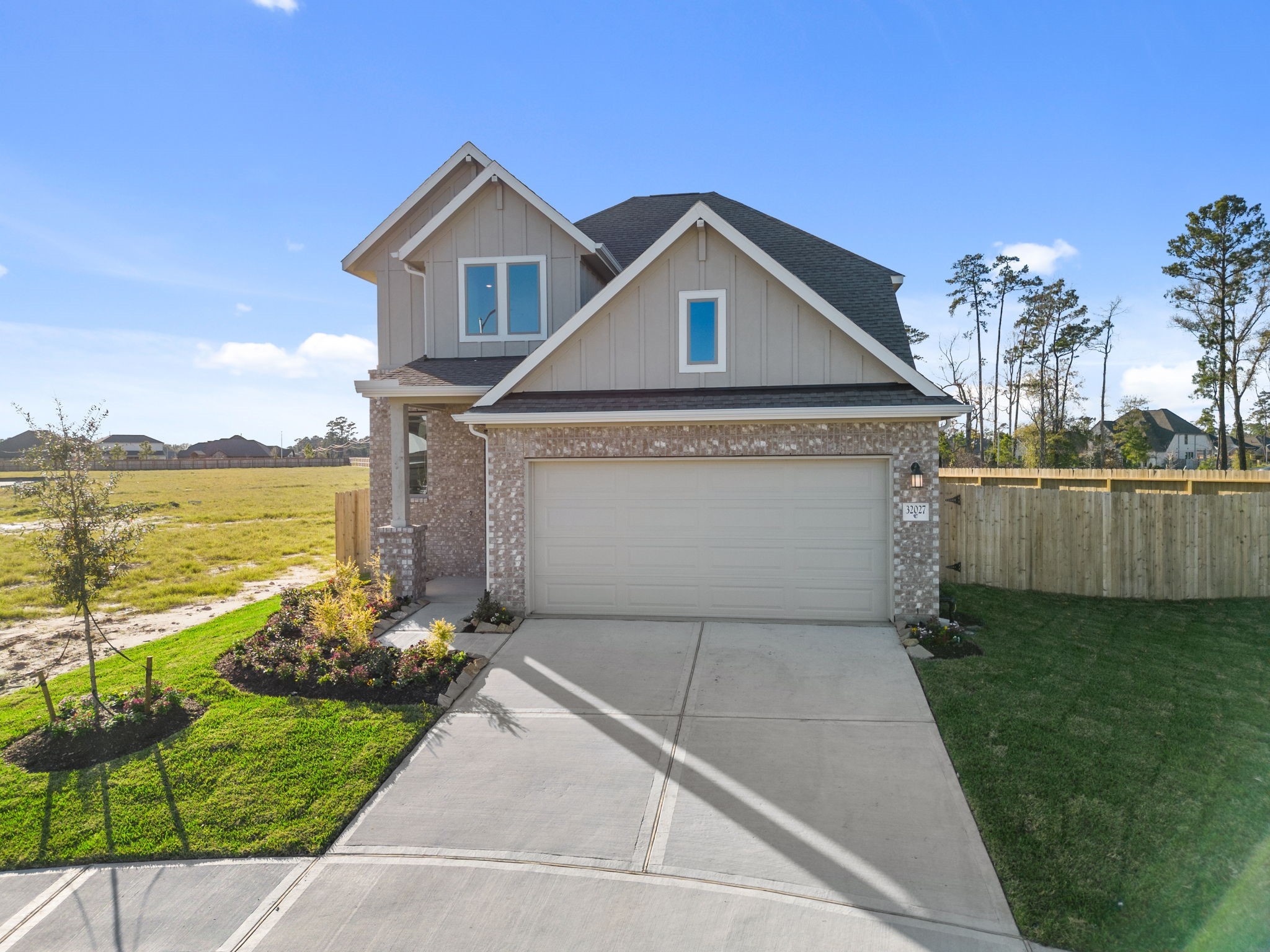32027 Retama Rnch Drive Spring, TX 77386 - Photo 25 of 33 a front view of a house with a yard