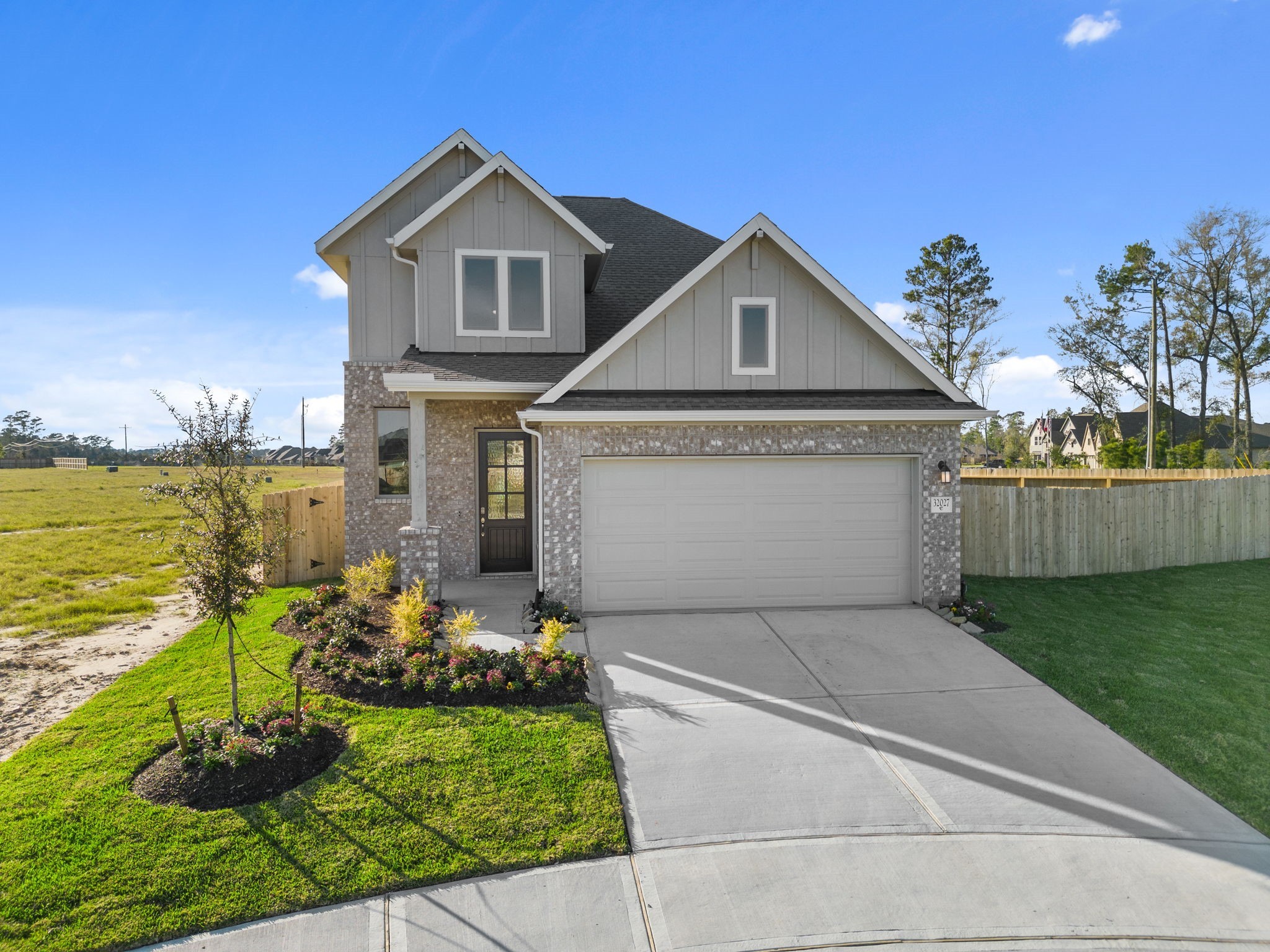 32027 Retama Rnch Drive Spring, TX 77386 - Photo 26 of 33 a front view of a house with garden