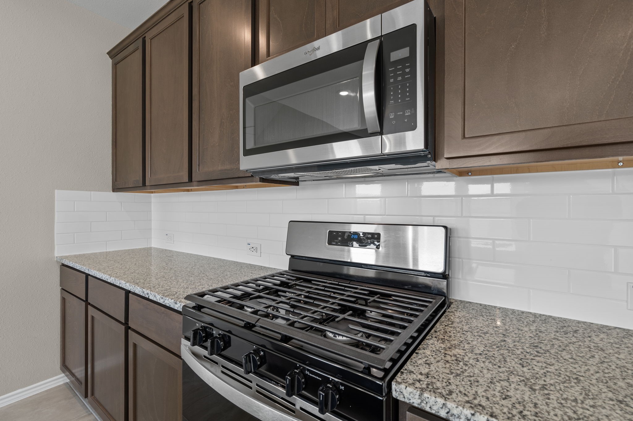 32027 Retama Rnch Drive Spring, TX 77386 - Photo 4 of 33 a stove top oven sitting inside of a kitchen