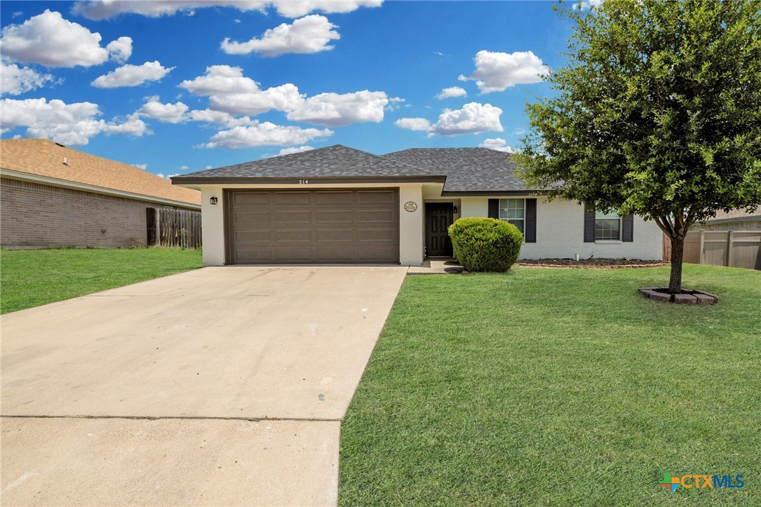 214 Timber Ridge Drive Nolanville, TX 76559 - Photo 1 of 31 a front view of a house with garden