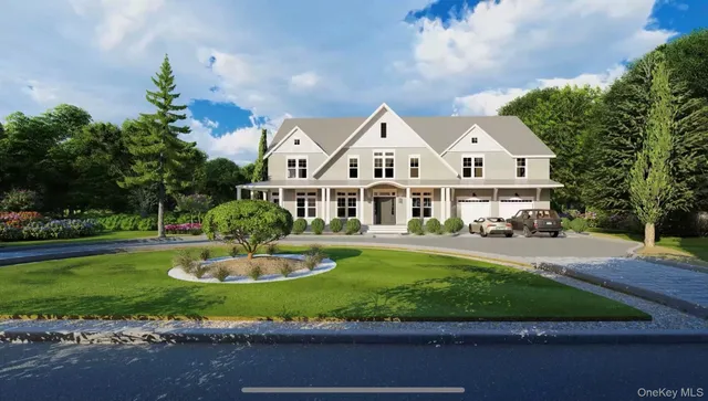 a front view of a house with a yard table and chairs
