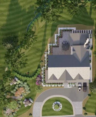 an aerial view of a house with outdoor space and a lake view