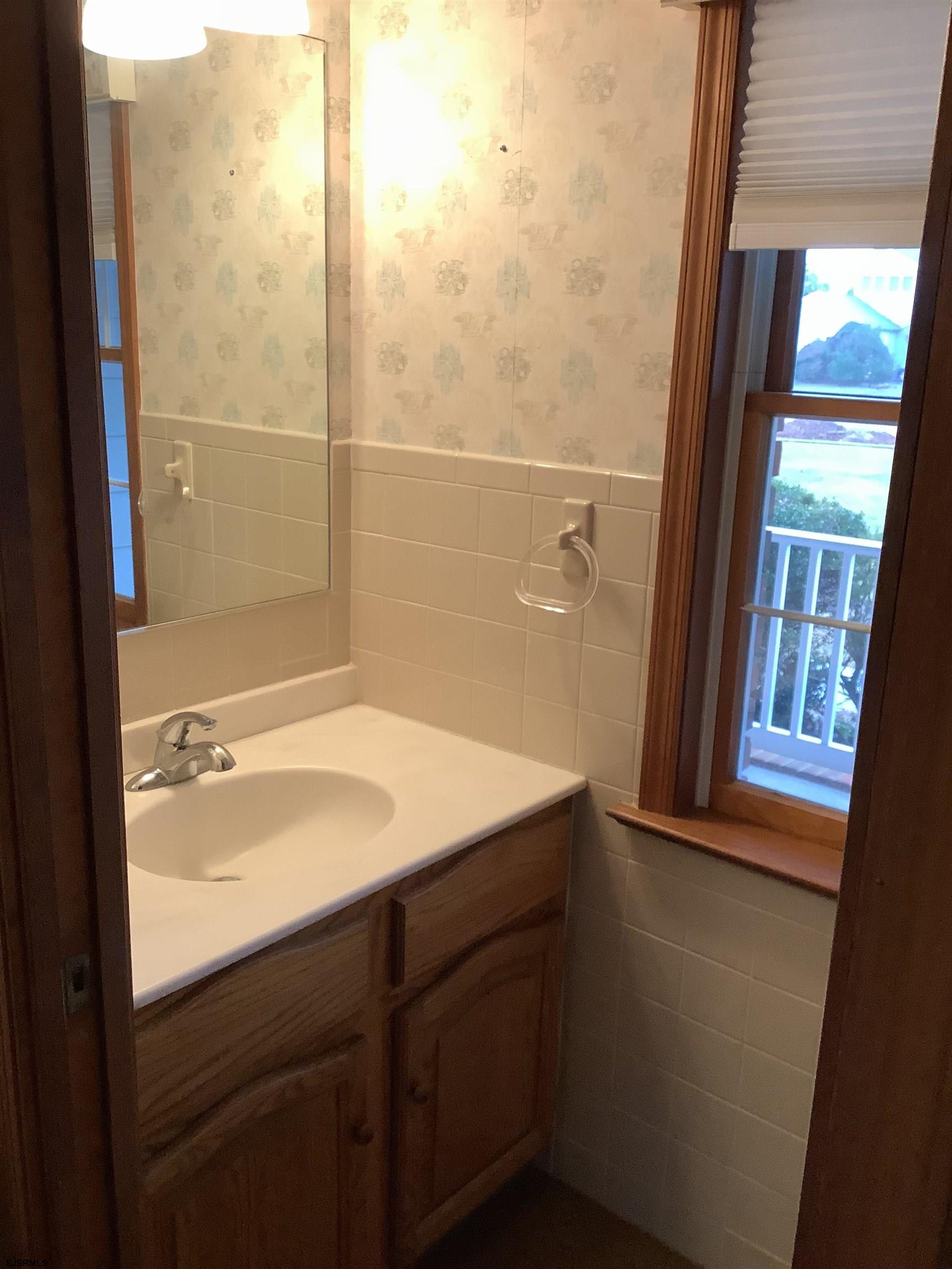 145 Allendale Road Marmora, NJ 08223 - Photo 15 of 27 a bathroom with a sink and a mirror