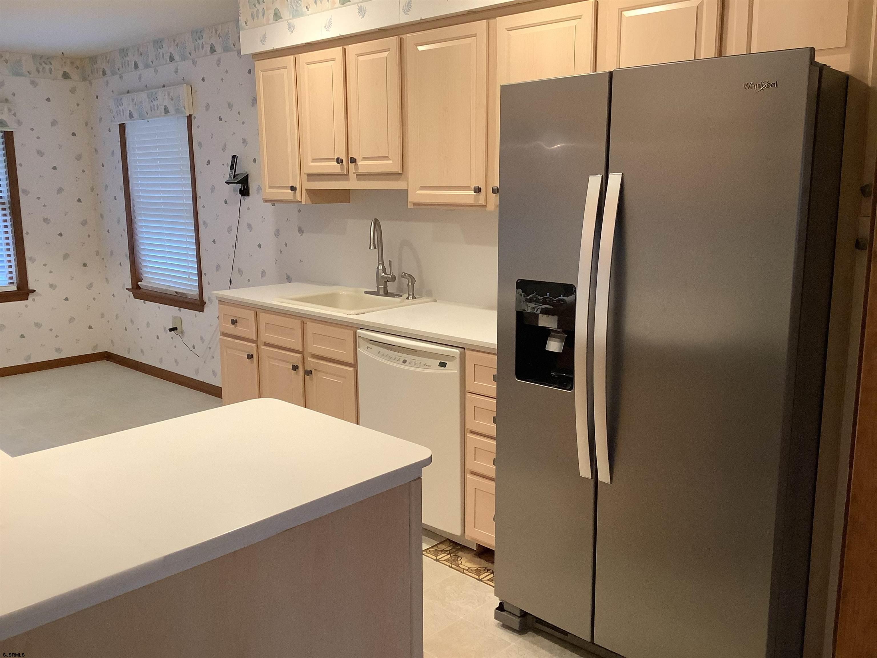 145 Allendale Road Marmora, NJ 08223 - Photo 16 of 27 a kitchen with stainless steel appliances a refrigerator sink and cabinets