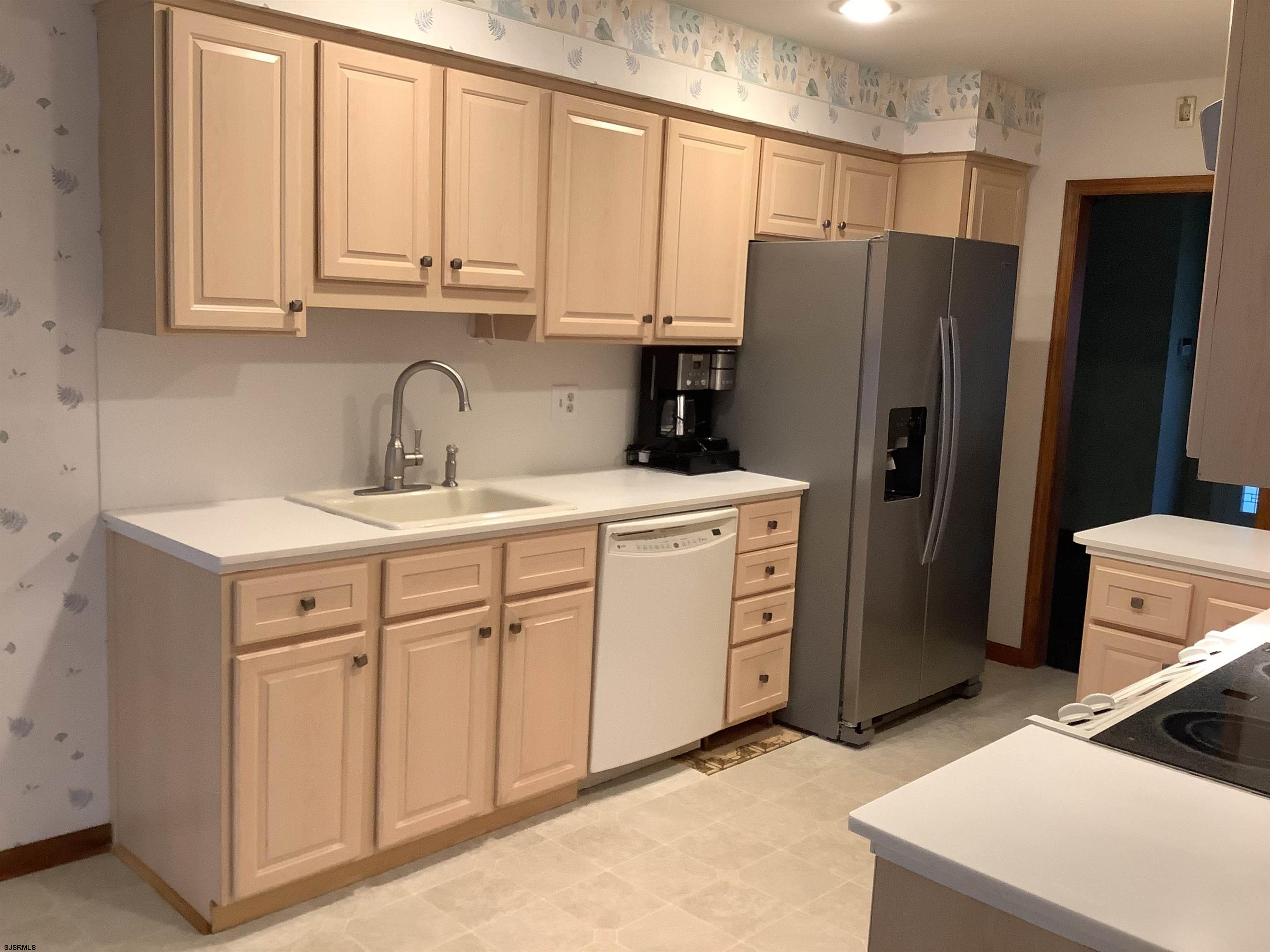145 Allendale Road Marmora, NJ 08223 - Photo 17 of 27 a kitchen with appliances a sink and cabinets