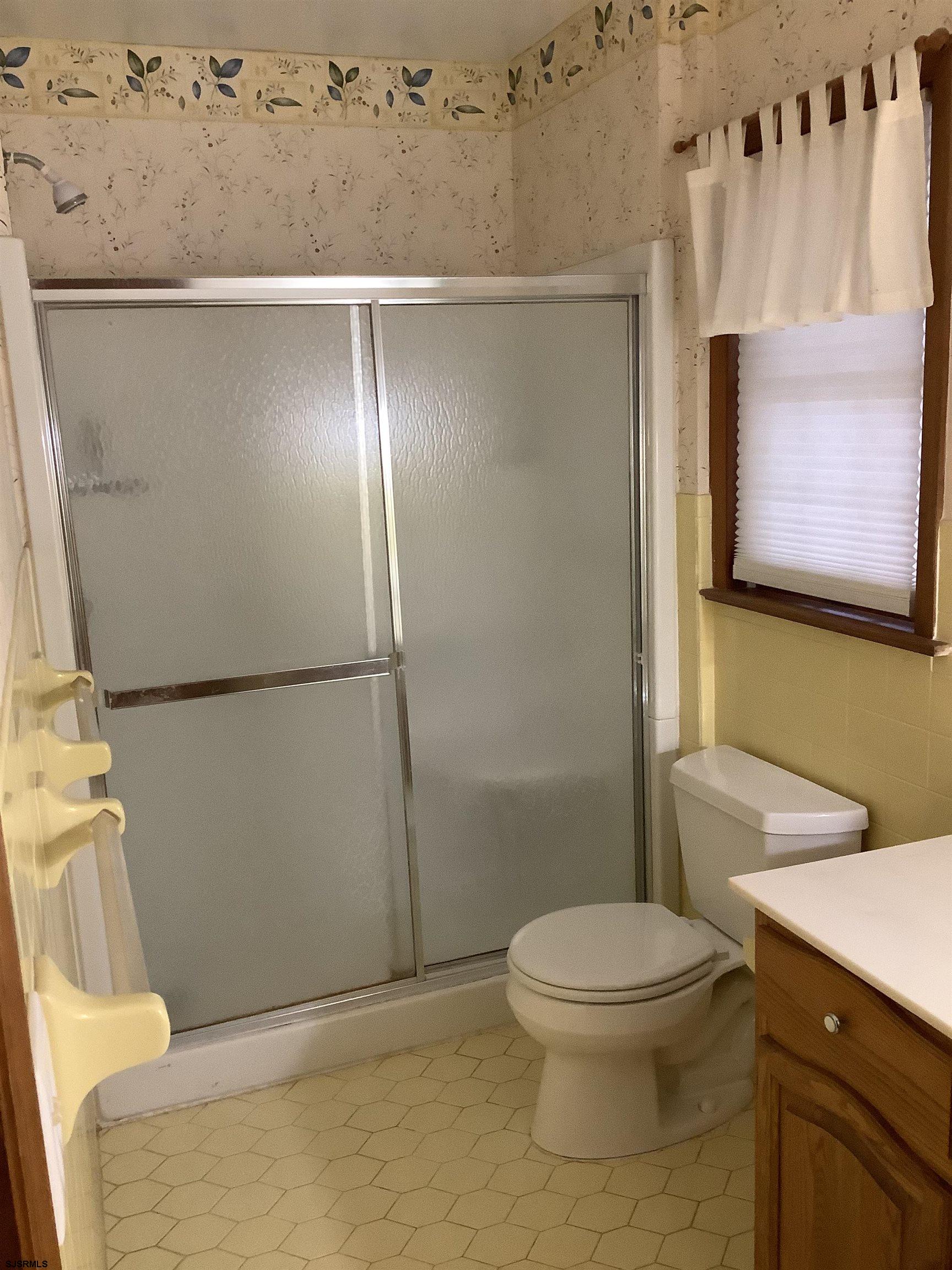 145 Allendale Road Marmora, NJ 08223 - Photo 21 of 27 a white toilet sitting next to a bathroom sink