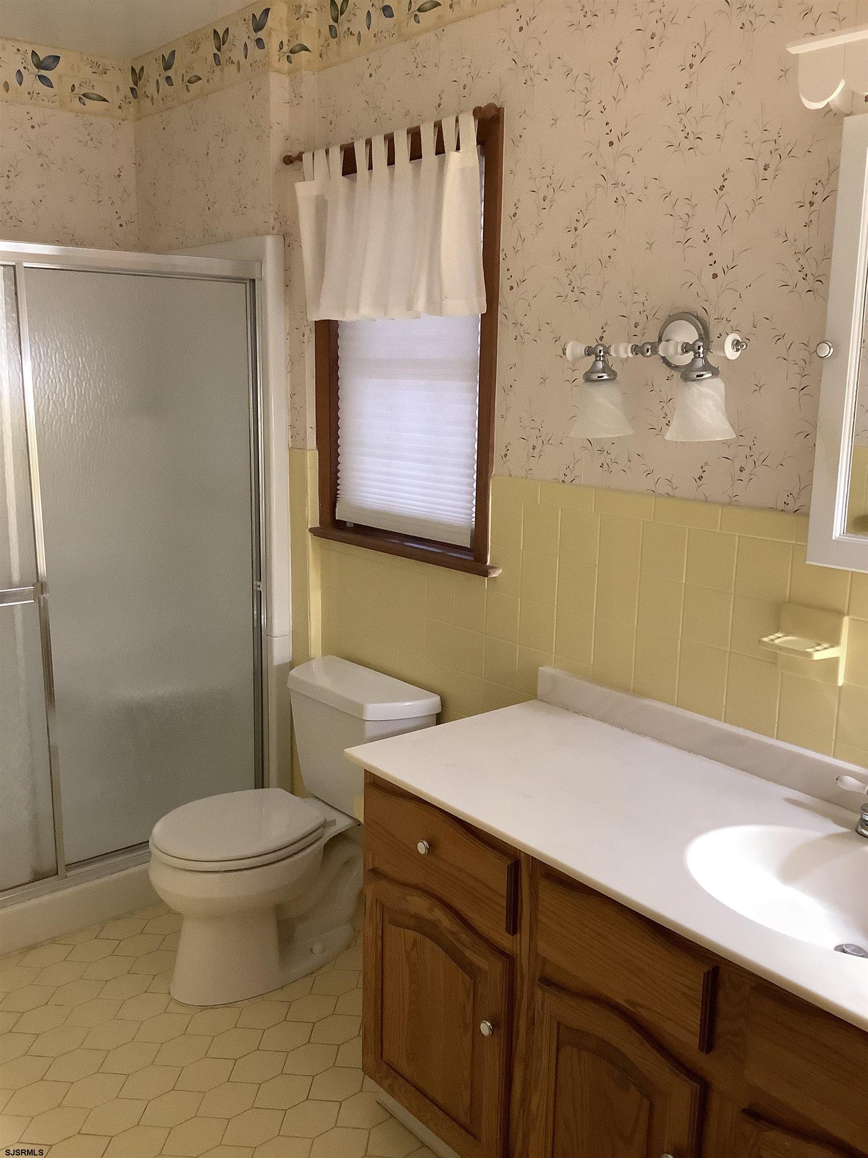 145 Allendale Road Marmora, NJ 08223 - Photo 22 of 27 a bathroom with a sink a toilet and shower