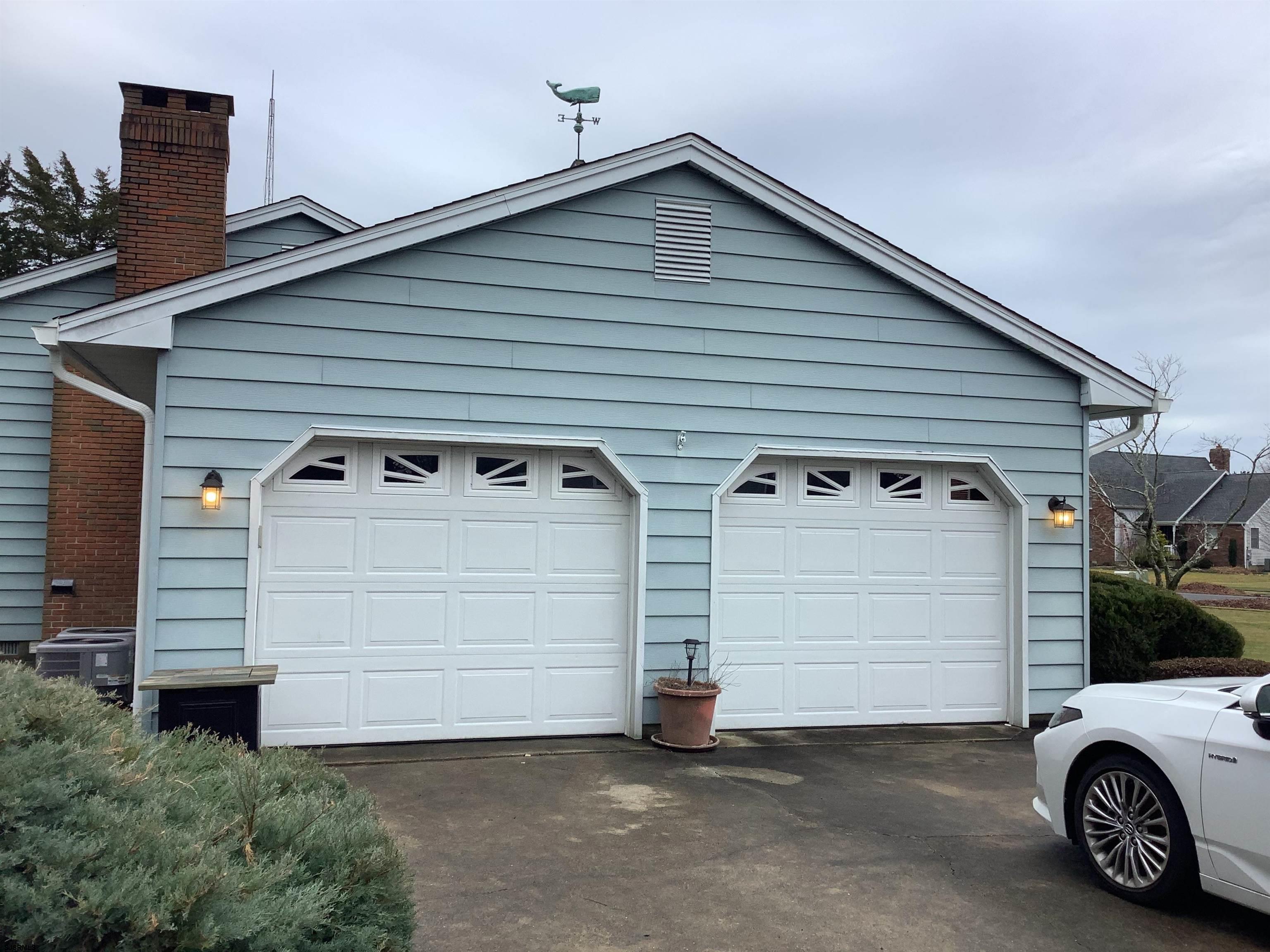 145 Allendale Road Marmora, NJ 08223 - Photo 26 of 27 a view of a white house with a garage