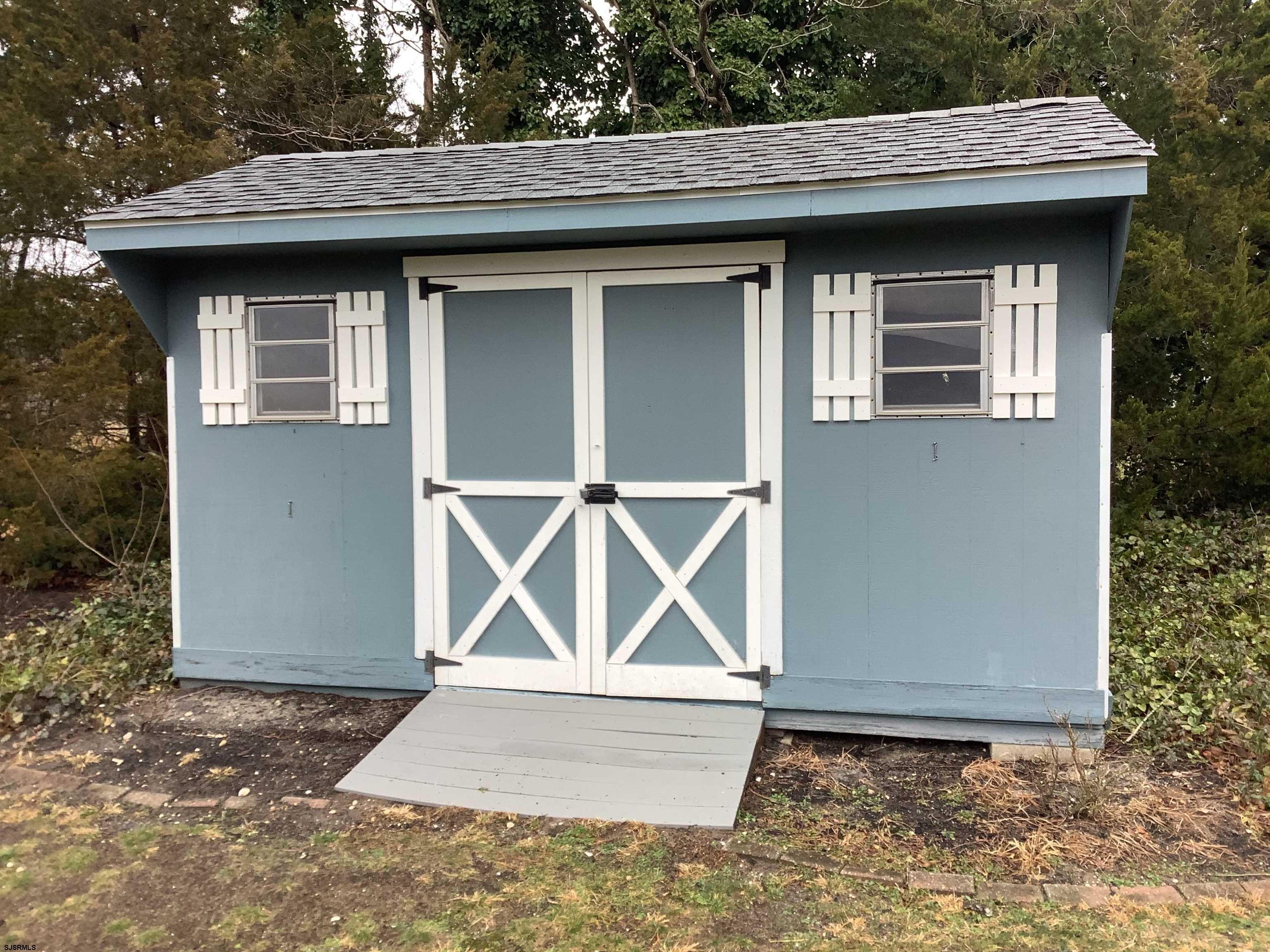 145 Allendale Road Marmora, NJ 08223 - Photo 27 of 27 a front view of a house with a yard and garage