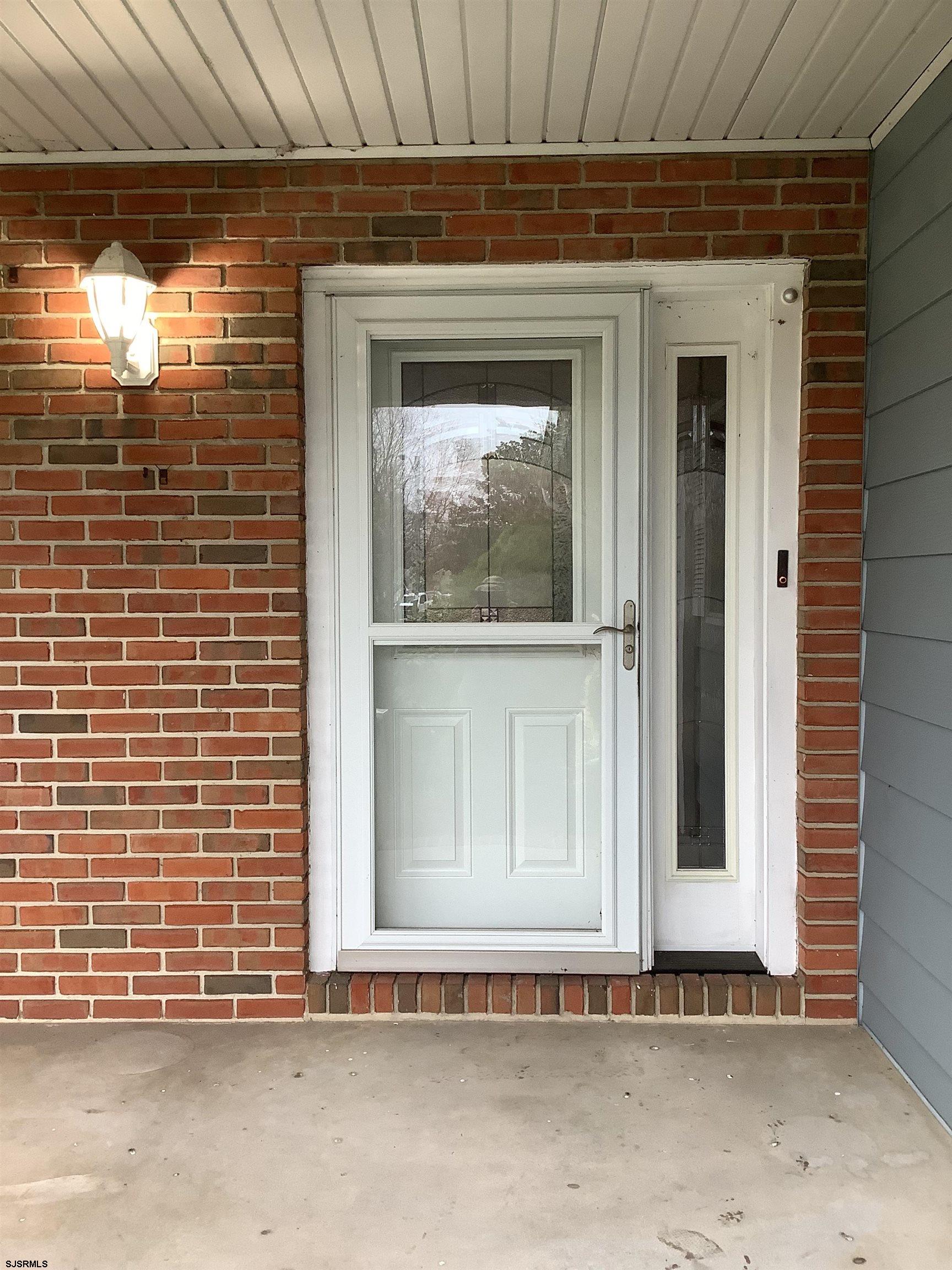 145 Allendale Road Marmora, NJ 08223 - Photo 4 of 27 a view of a house with a door