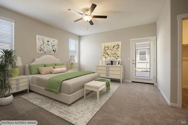 a bedroom with a bed and a couch