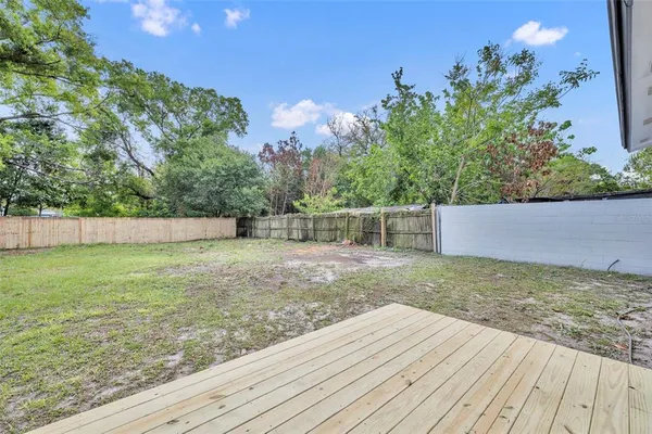 a backyard of a house with lots of green space