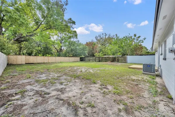 a view of outdoor space with deck and yard