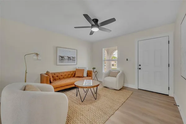 a living room with furniture and white walls