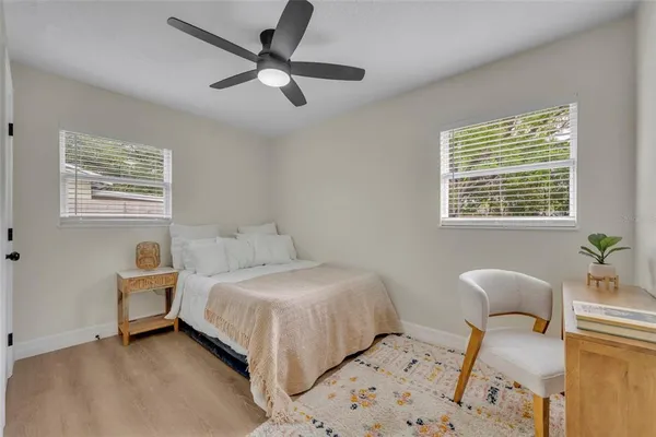 a bedroom with a bed and a chair