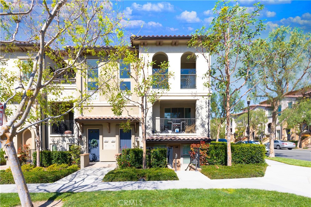 203 Native Spring Irvine, CA 92618 - Photo 1 of 1 a front view of a house with garden