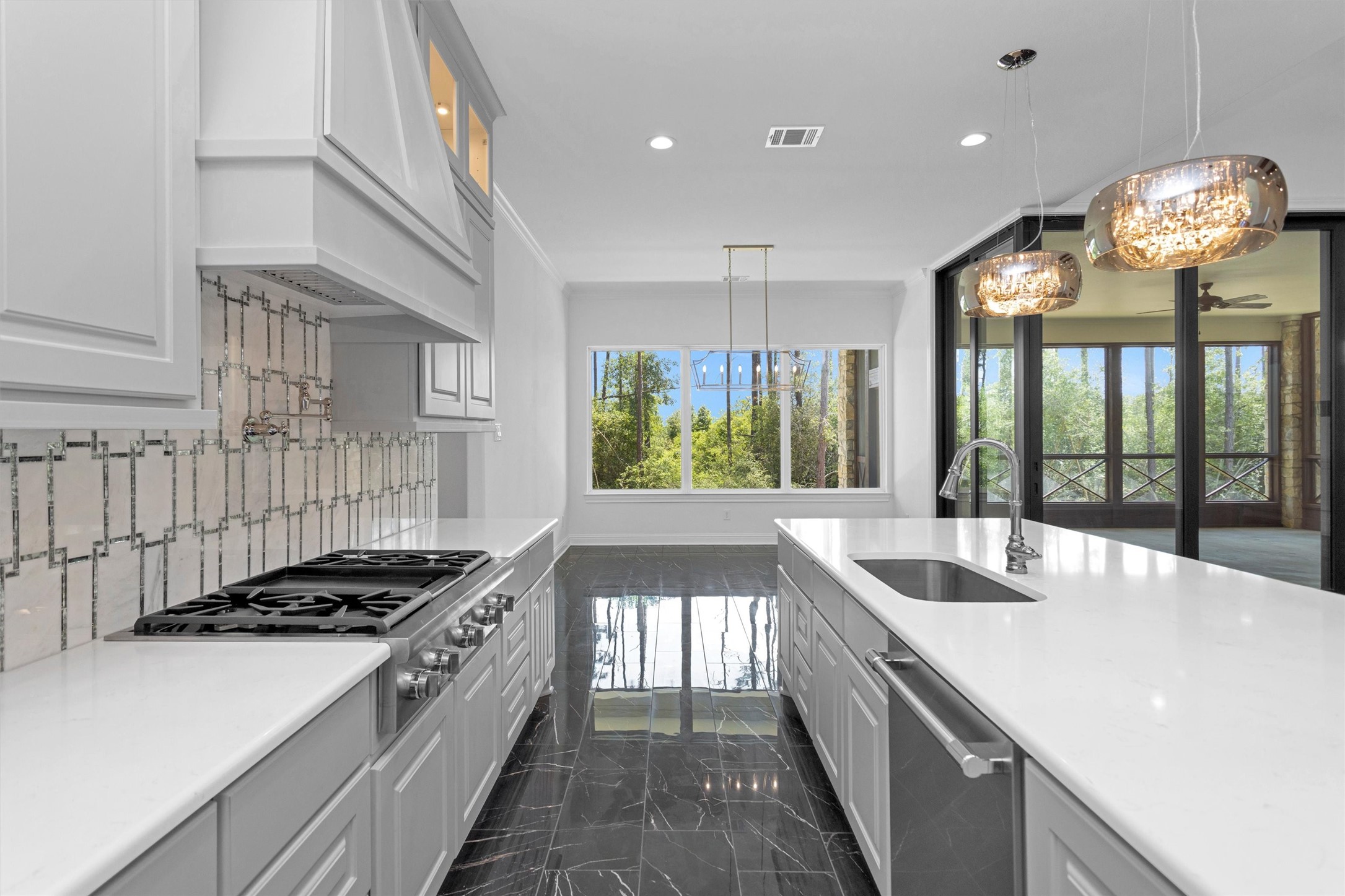16081 Forest Mill Road Willis, TX 77378 - Photo 11 of 39 a kitchen with stove and large window