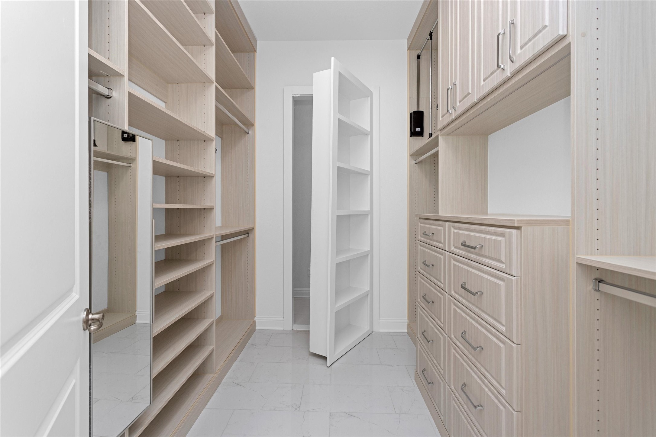 16081 Forest Mill Road Willis, TX 77378 - Photo 17 of 39 a view of walk in closet with empty racks