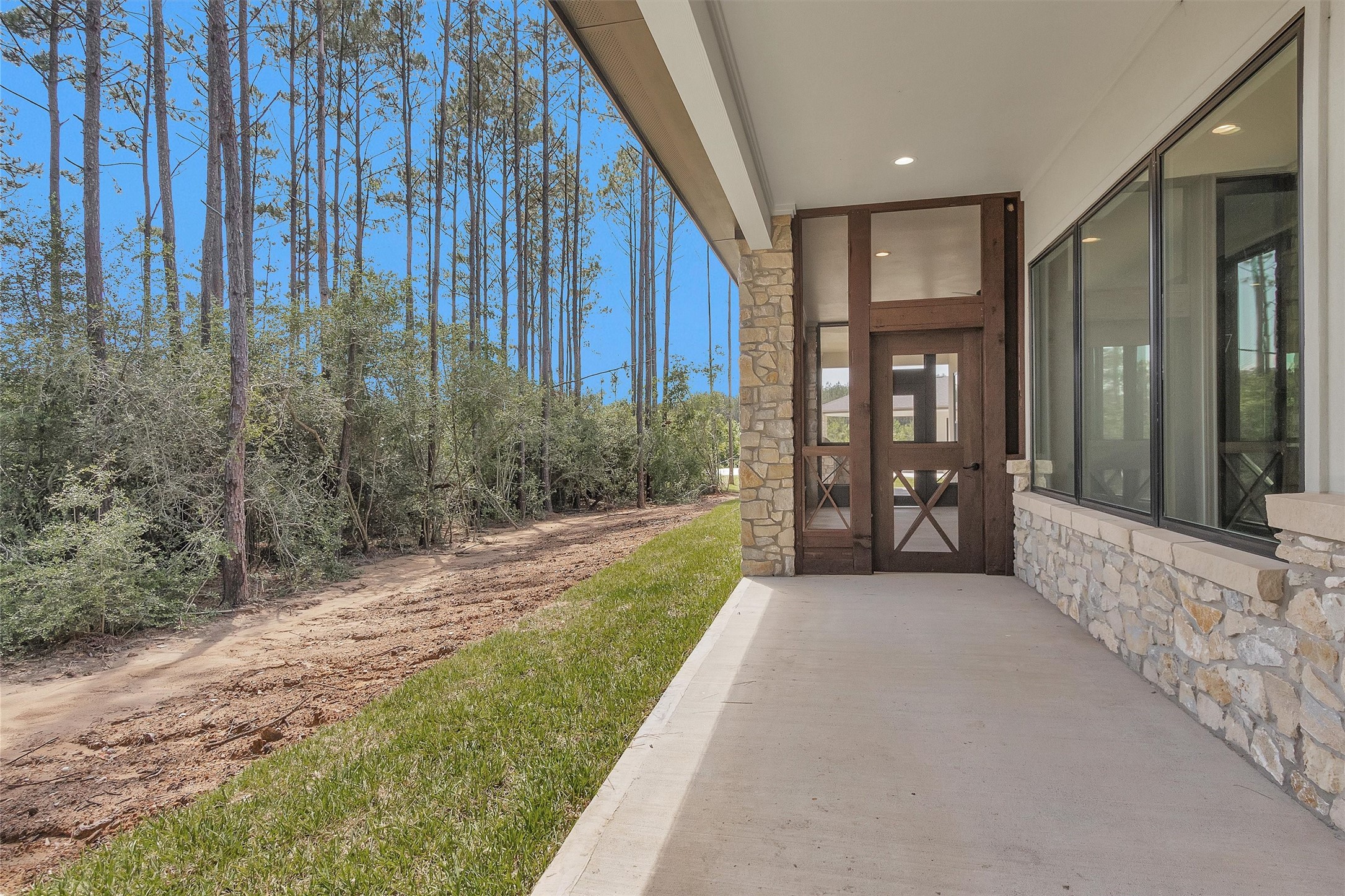 16081 Forest Mill Road Willis, TX 77378 - Photo 28 of 39 a view of a porch with a backyard