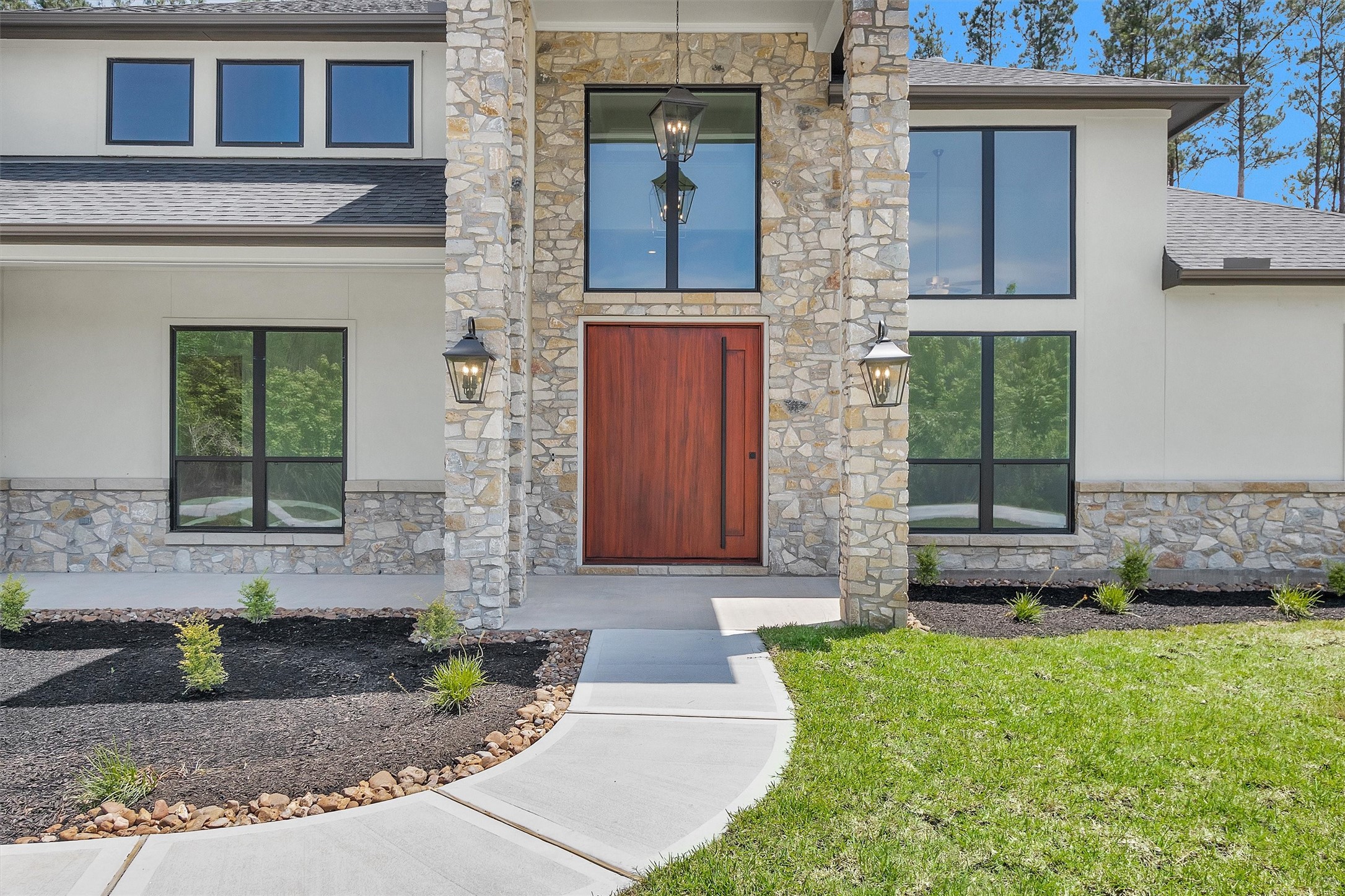 16081 Forest Mill Road Willis, TX 77378 - Photo 3 of 39 a front view of a house with garden