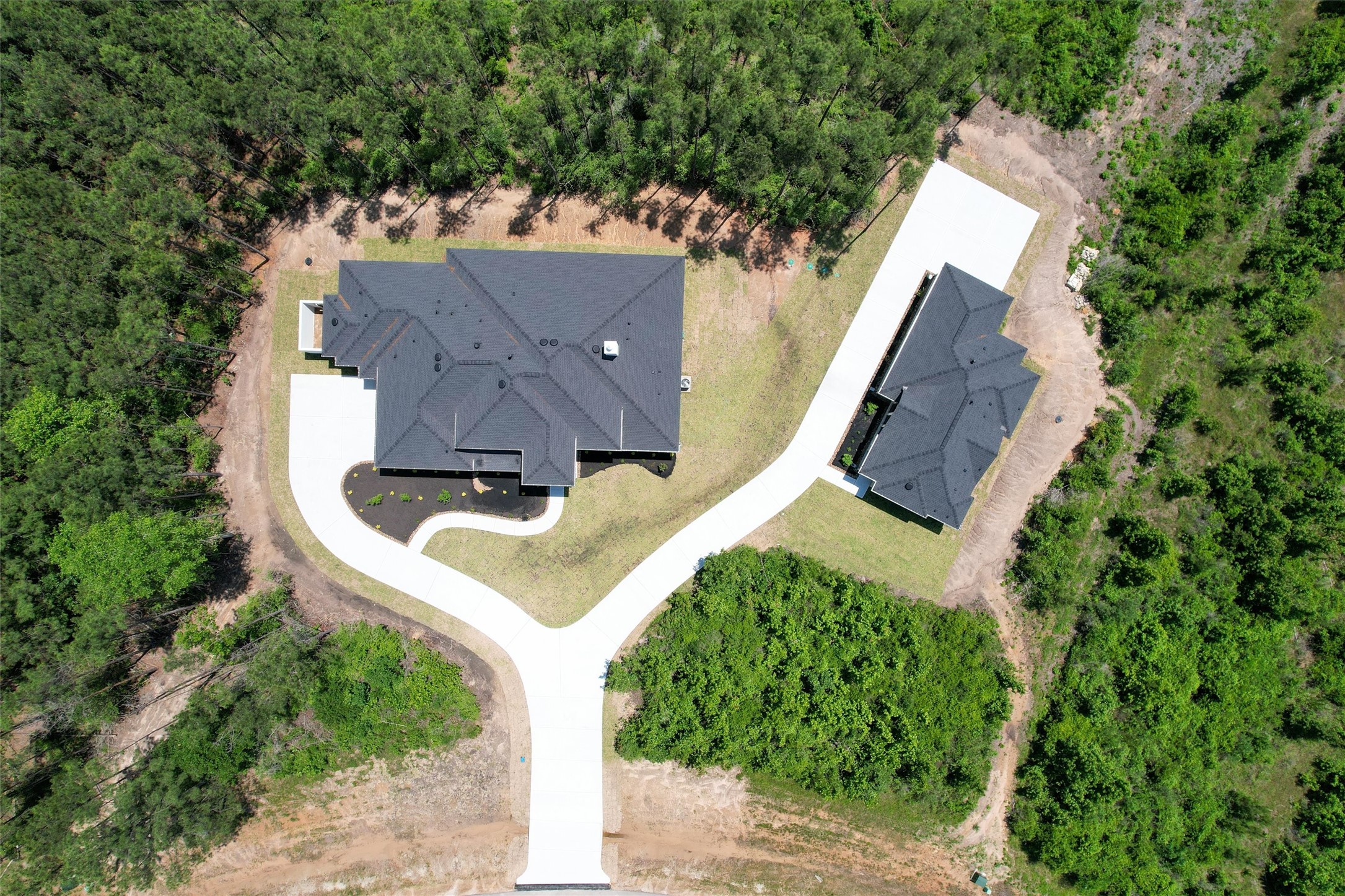 16081 Forest Mill Road Willis, TX 77378 - Photo 39 of 39 an aerial view of a house with a yard