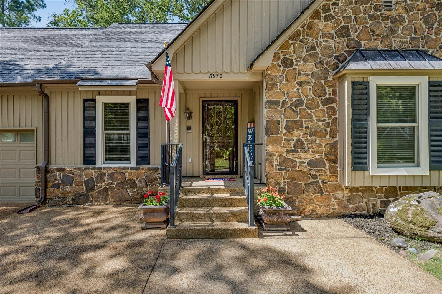 8970 Farmoor Road Germantown, TN 38139 - Photo 3 of 35 Stone veneer and siding exterior with a dark asphalt shingle roof